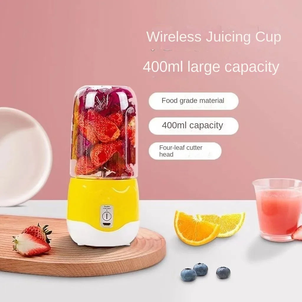 Wireless juicing cup with fruits and a glass of juice on a pink background