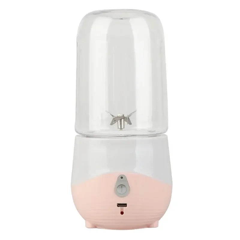 Pink and clear portable humidifier on a white background