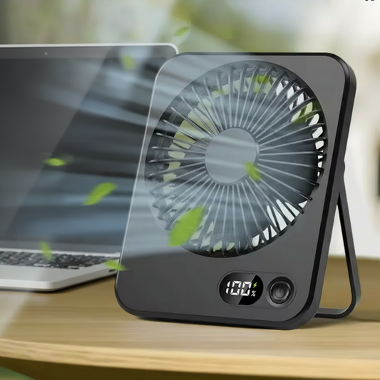 fan on desk next to computor laptop