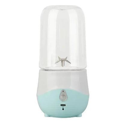 Portable blender with a light blue base and clear top on a white background
